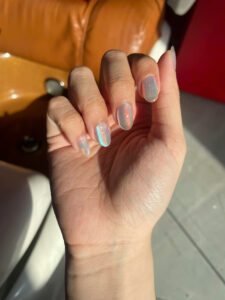 Pastel blue and peach nails at Fame Nails District 7