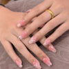 Pink floral clear tip nails at Fame Nails District 7