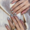 Silver crystal floral nails at Fame Nails District 7
